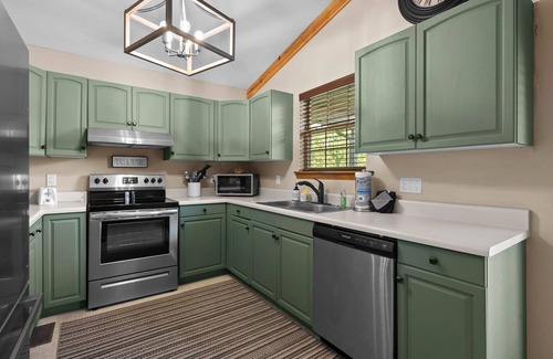 Sevierville Cabin | Mountain View! Dollywood 1 mi! Hot Tub, Fire Pit, King Suites, Arcade, Dogs OK!