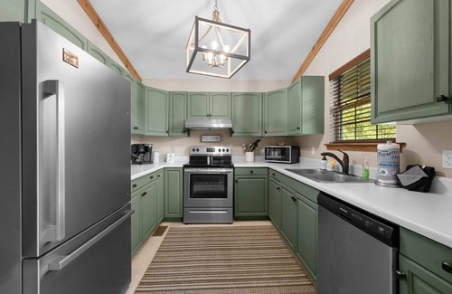 Sevierville Cabin | Mountain View! Dollywood 1 mi! Hot Tub, Fire Pit, King Suites, Arcade, Dogs OK!