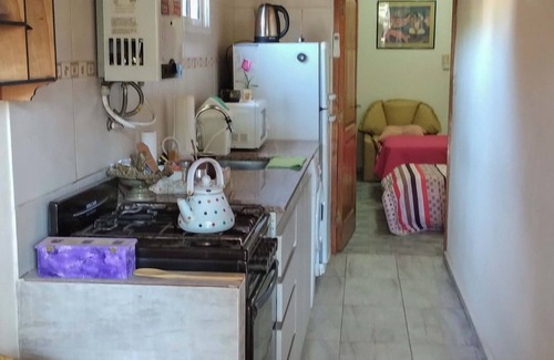 Juana Koslay Apartment | Nancy and Carlos's house, view of the mountains, swimming pool and barbecue area.