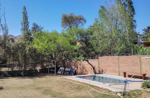 Juana Koslay Apartment | Nancy and Carlos's house, view of the mountains, swimming pool and barbecue area.