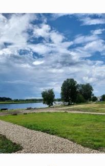Jurmala Other | Natura Park Jurmala campsite with tent sites near a river