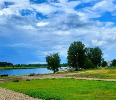 Jurmala Other | Natura Park Jurmala campsite with tent sites near a river