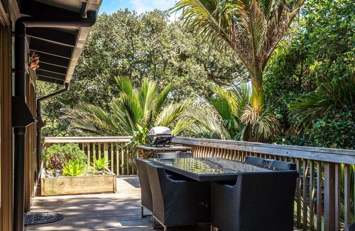 Onetangi Cottage | Near Onetangi beach, Treetops is a family bach on the edge of the forest.