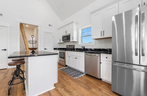Carova Beach Cottage | New CANAL front home a few rows back from the OCEAN! Beach passes provided!