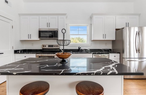 Carova Beach Cottage | New CANAL front home a few rows back from the OCEAN! Beach passes provided!