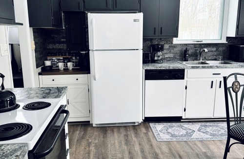 Interlochen Cottage | New~Enchanting modern cottage tucked away in the trees. Heavenly Kingsize Bed