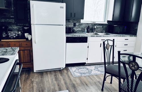 Interlochen Cottage | New~Enchanting modern cottage tucked away in the trees. Heavenly Kingsize Bed