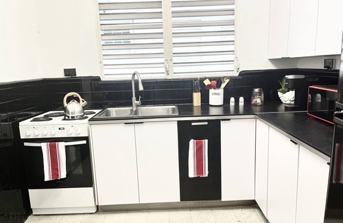 Santurce Apartment | New Listing! Central Location-Walk to Beach+near Airport+2 balconies+Mango Tree