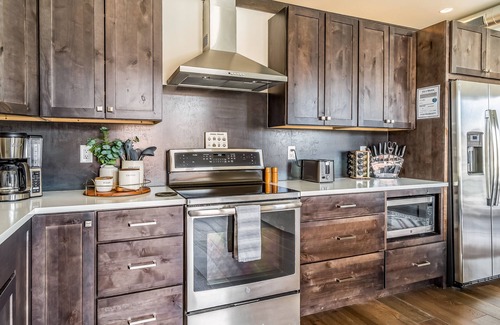 Whitefish Condo | New, luxe condo in the heart of town with mountain view, balcony & bus to slopes