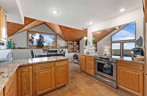 Evergreen House | New! Mountain View. 4 BR. Hot tub. Pets Welcome. Great Views.