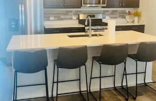 Watkins Apartment | New, spacious and inviting home.