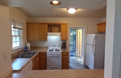 Golden Hill Apartment | Nice 1 bedroom apartment set up with 2 queen beds with one in the living room. The kitchen and bar area still provide ample space and can accommodate up to 5 people.