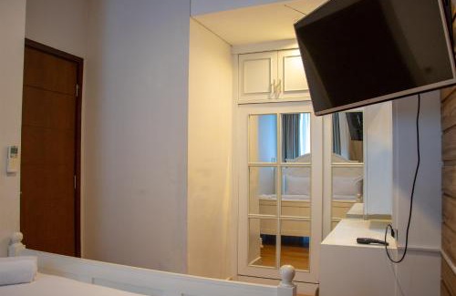 Menteng Apartment | Nice and Cozy 1BR with Extra Room Apartment at Capitol Park Residence By Travelio