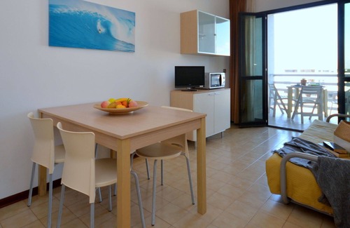 Lignano Sabbiadoro Apartment | Nice apartment for 4 guests with pool, A/C, TV, terrace and pets allowed