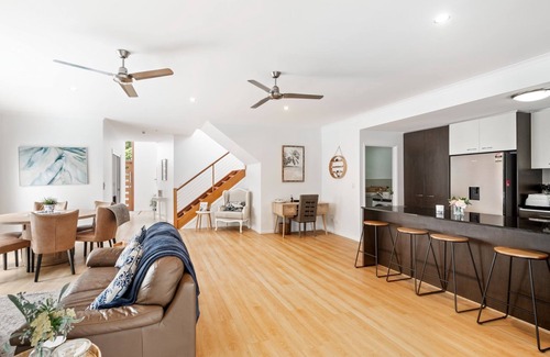 Parrearra House | North-facing double storey home showcasing a delightful outlook across opposite waterfront parkland