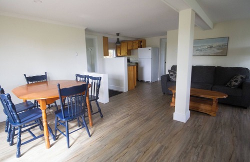 Yarmouth County House | Ocean cottage nestled amongst tall oak trees, pet friendly.