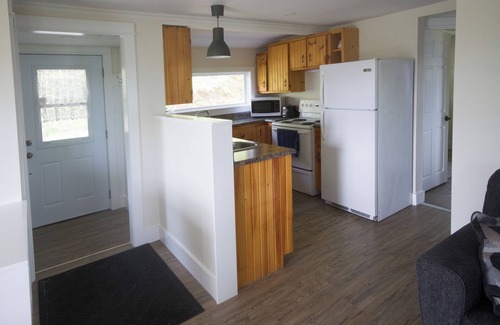 Yarmouth County House | Ocean cottage nestled amongst tall oak trees, pet friendly.