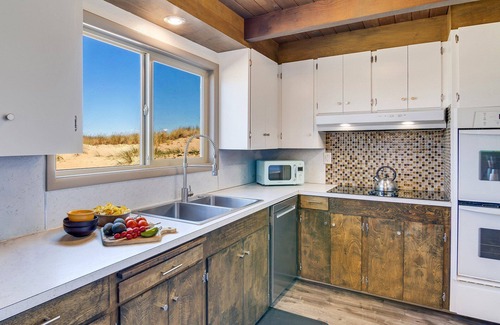 Bayshore House | Ocean Front House Sits Right on a Sandy Beach!
