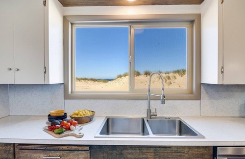 Bayshore House | Ocean Front House Sits Right on a Sandy Beach!