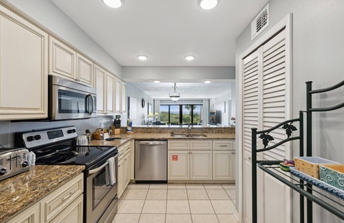 Cocoa Beach Condo | Ocean Front Sandcastles Condo: Steps to the beach with Pool & Hot Tub!