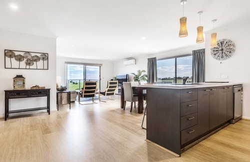 Lakes Entrance House | Ocean Vista - A view of the ocean over the large backyard
