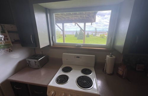 Cormierville House | Oceanfront paradise, 4-bedroom house in Cocagne with hot tub, WiFi, AC.