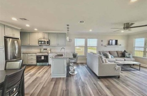Port Bolivar House | Oceanfront Serene Coastal Escape in Crystal Beach, TX: Yellow Daisy by the Sea