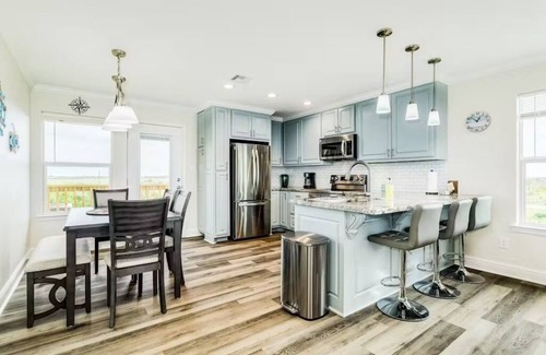 Port Bolivar House | Oceanfront Serene Coastal Escape in Crystal Beach, TX: Yellow Daisy by the Sea