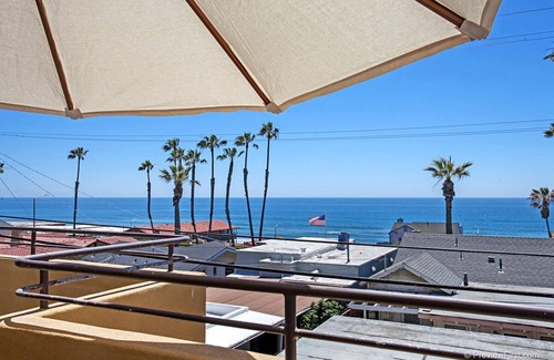 Townsite Condo | OCEANSIDE BEACH located by pier and marina! Ocean Views! Walk to Village!