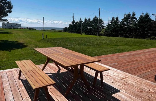 DeSable Cottage | Oceanview haven- steps to the beach in this 2bedroom cottage with large deck