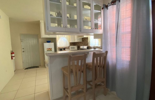 Below Rock Apartment | Oistins 2 Bed Apartment with AC Near Miami Beach & Oistins.