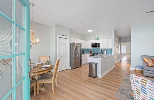 New Smyrna Beach Condo | ON Flagler Avenue! Dog Friendly with Balcony and Parking. Walk to the Beach!