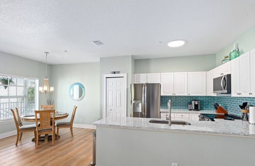 New Smyrna Beach Condo | ON Flagler Avenue! Dog Friendly with Balcony and Parking. Walk to the Beach!