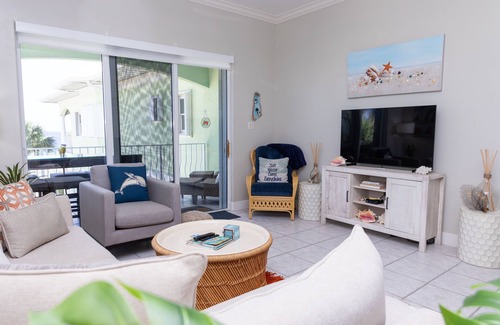 Old Man Bay Condo | On The Bay 312 is located on a white sandy beach in the quaint Old Man Bay.