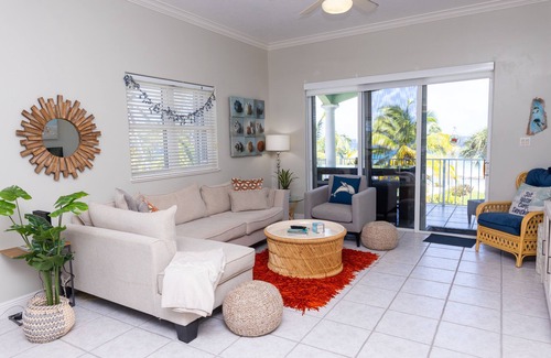 Old Man Bay Condo | On The Bay 312 is located on a white sandy beach in the quaint Old Man Bay.