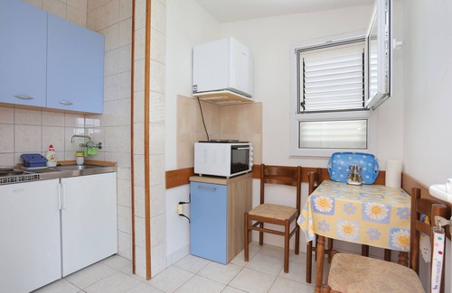 Municipality of Trogir Apartment | One bedroom apartment with terrace and sea view Arbanija, Čiovo (A-18797-b)