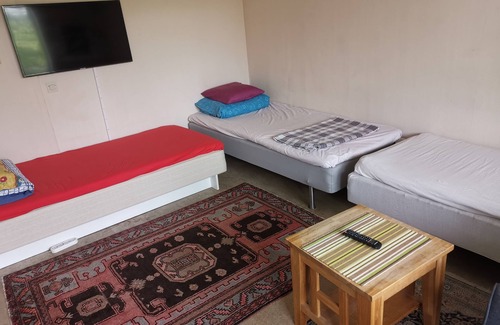 Angered Apartment | One large room with 3 single beds. Max for three people 12 min from city center