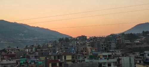 Nagarjun House | One room with two single beds with natural views