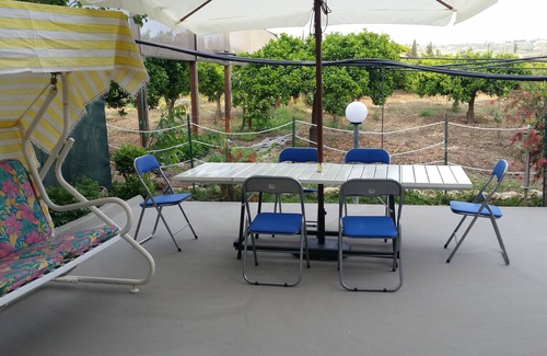 Sciacca House | Orange and lemon villa with garden and aromatic herbs.