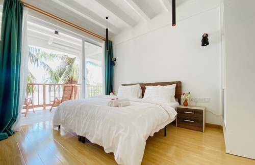 Thulusdhoo Island Hotel | Overlooking ocean that meets cloudless sky, Coral Inn is a sanctuary of serenity