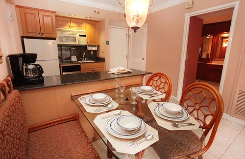 Palm Beach Shores Condo | Palm Beach Shores Resort - Comfortable King Bed - Private Beach