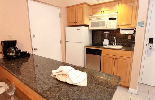 Palm Beach Shores Condo | Palm Beach Shores Resort - Comfortable King Bed - Private Beach