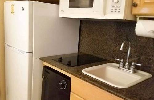 Palm Beach Shores Condo | Palm Beach Shores Resort - Comfortable King Bed - Private Beach