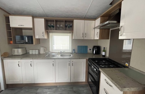 Christchurch House | Palm Trees holiday home - luxury home on the 5 star Hoburne Park holiday resort