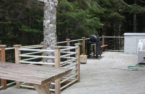 Cape Meares Cottage | Peaceful 4BR Cape Meares Home | Ocean Views, Forest Setting, Wraparound Deck + King Bed