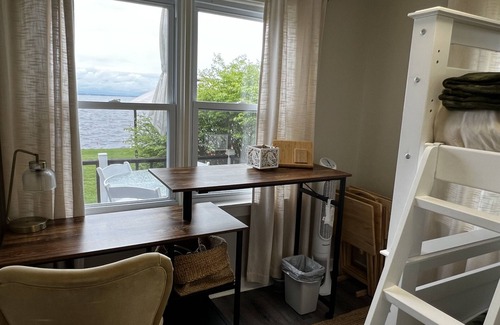 Bernhards Bay Cottage | Peaceful couples retreat on Oneida Lake. Insta-worthy views. Cozy interior.