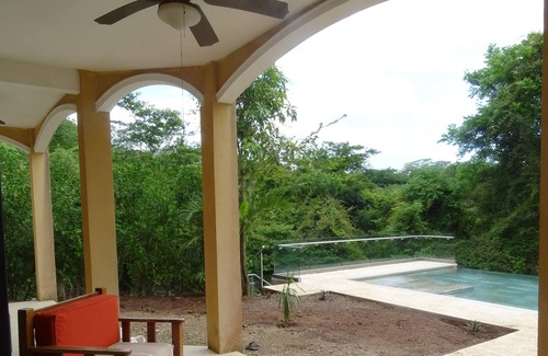 Tamarindo Apartment | Peaceful, entire first floor apartment with pool surrounded by wildlife