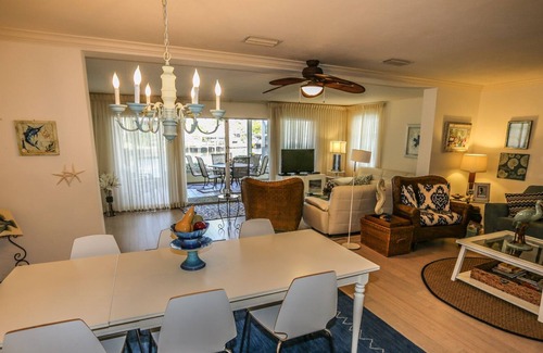 Mid Island House | Peaceful, spacious canal-front home w. private screened-in pool