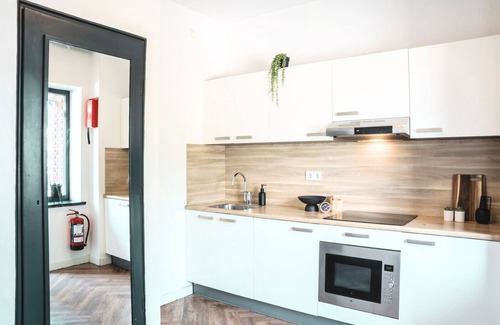 Centrum Apartment | Perfect for solo travelers looking for a simple and budget-friendly base. This cozy room comes with a TV and workspace, and you’ll have access to a shared kitchen and shared bathroom.