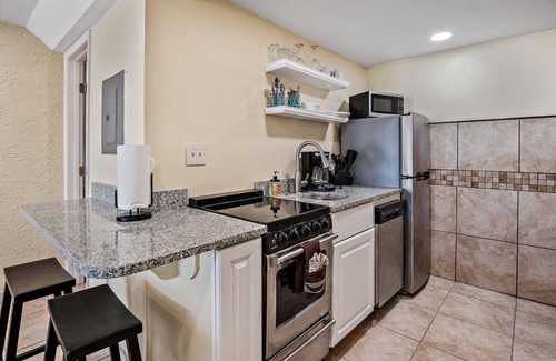 Panama City Beach Condo | Pet Friendly Ground Level Steps to the Sand! Pool Hot Tub WIFI